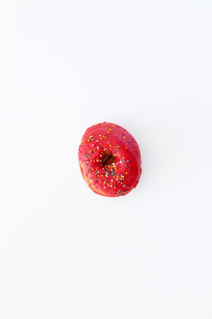 Red donuts with icing on white background Sweet donuts