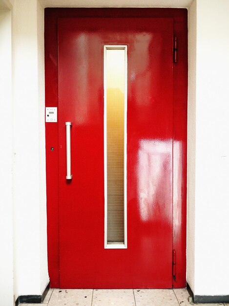 Red door at entrance of elevator
