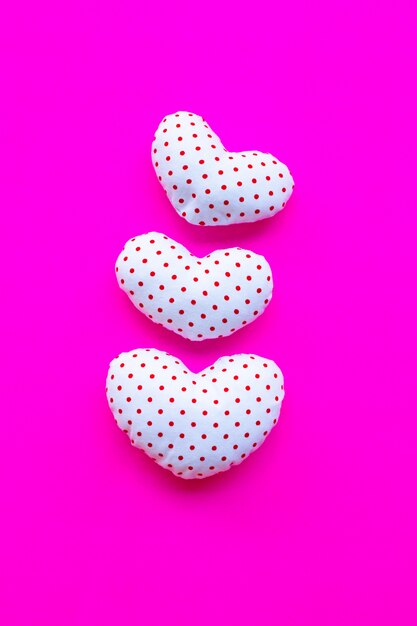 Red dots on white heart shape