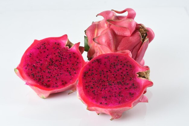 red dragon fruit pitaya isolated on white backgroundsliced and whole