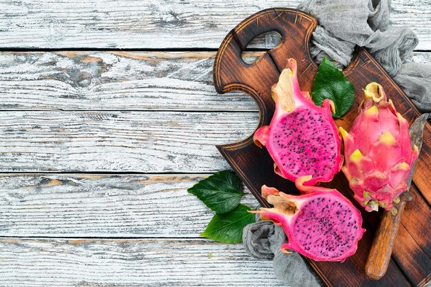 Red Dragon Fruit on a white wooden background Pitahaya Tropical Fruits