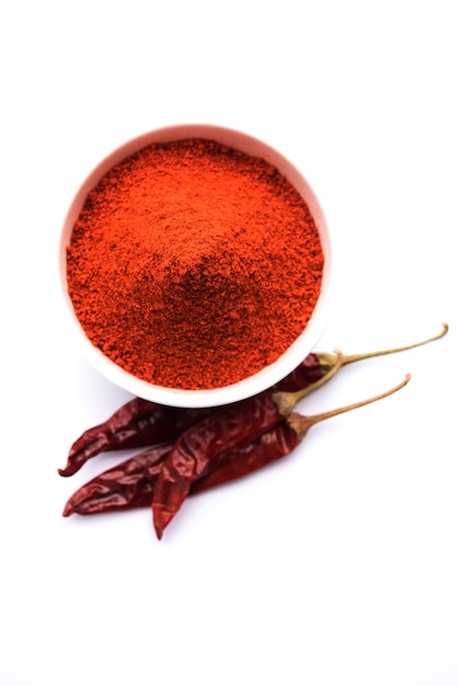 Red dried Mirchi mirch or Chilly Powder in a bowl over moody background, selective focus