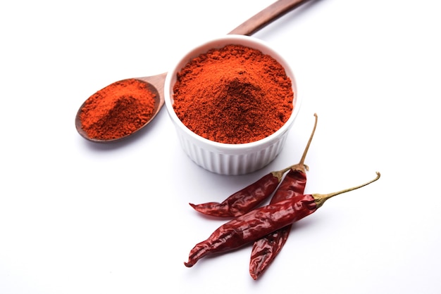 Red dried Mirchi mirch or Chilly Powder in a bowl over moody background, selective focus