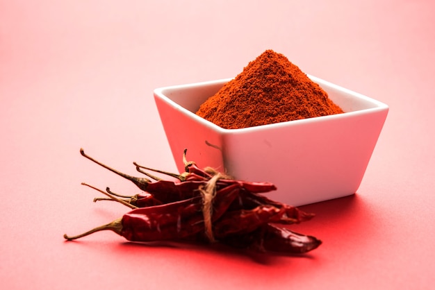 Red dried Mirchi mirch or Chilly Powder in a bowl over moody background, selective focus