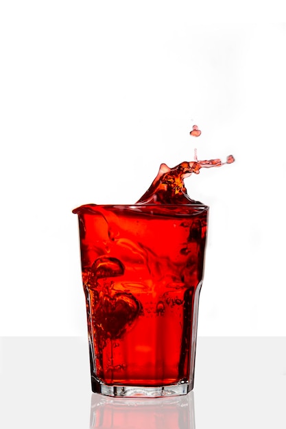 Red drink splashed on isolated on white background