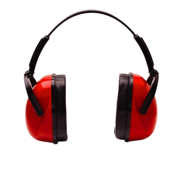 Red earphones to work at the machine cut out on white surface