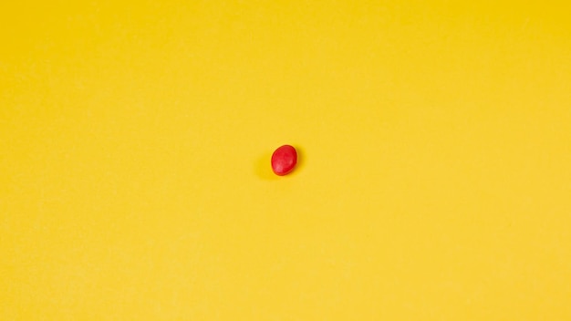 Red egg on a yellow background