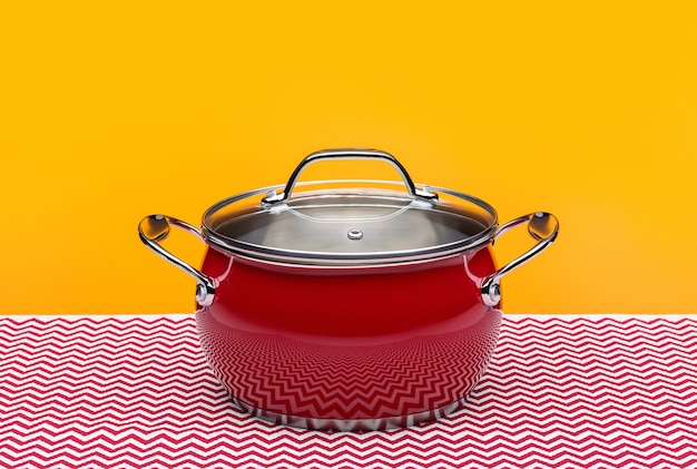 Red enamel saucepan with glass lid, isolated.