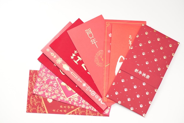 Red envelope packet chinese new year, hongbao with the character 'Happy New Year' on white background for Chinese New Year. Translation: Good luck in the year