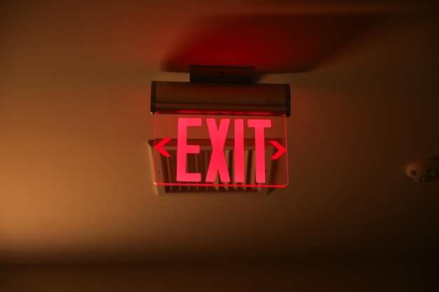 A red exit sign that says exit on it