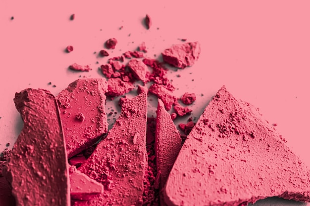 Red eye shadow powder as makeup palette closeup crushed cosmetics and beauty texture