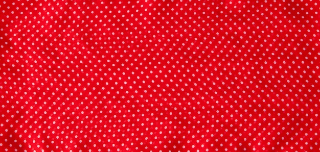 Tessuto rosso con pois bianchi