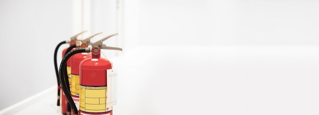 The red fire extinguisher is ready for use in case of an indoor fire emergency