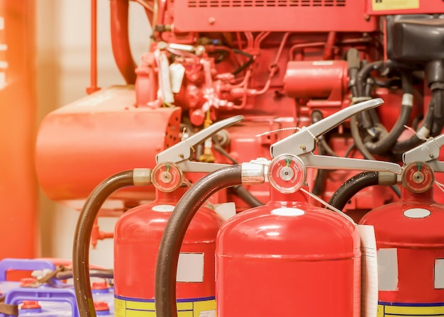 Photo the red fire extinguisher is ready for use in case of an indoor fire emergency.