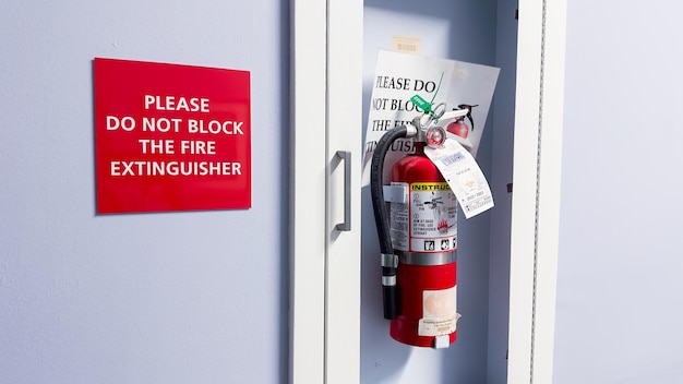 A red fire extinguisher sign on a door