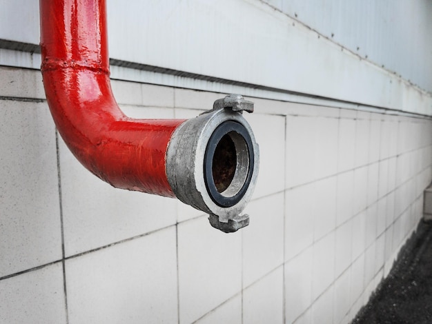 Red firefighting pipeline with a closeup lock