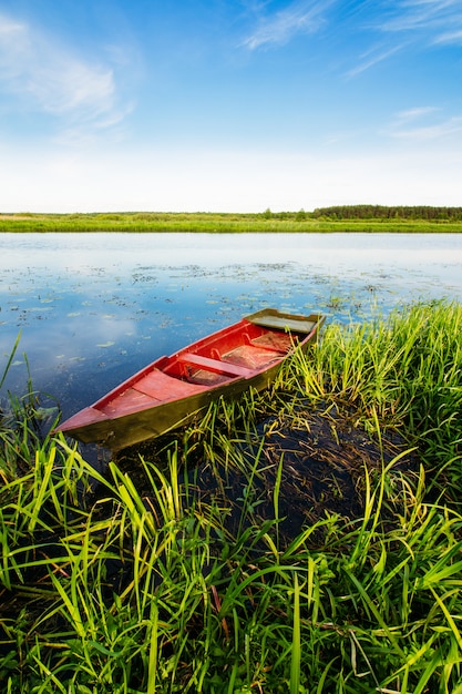 Red fisherman's boat on the water