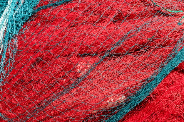 赤い漁網の山の背景テクスチャ極端なクローズアップ