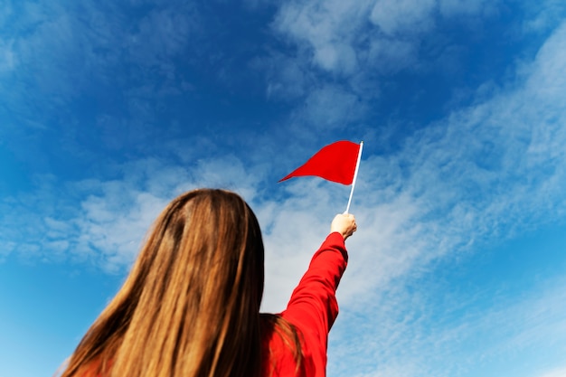 Photo red flag collage held by girl