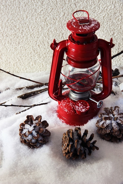 Red flash light and Christmas decoration on light background