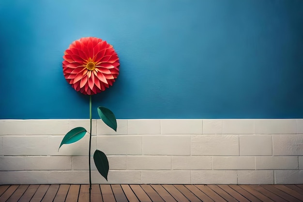 A red flower is in front of a blue wall