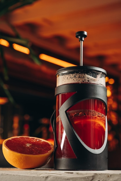 Red french press tea with grapefruit 