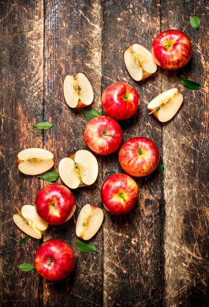 Red fresh apples on wooden table