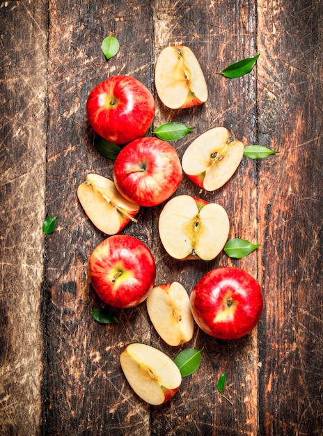 Red fresh apples on wooden table