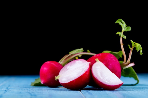 Red fresh radish on wooden 