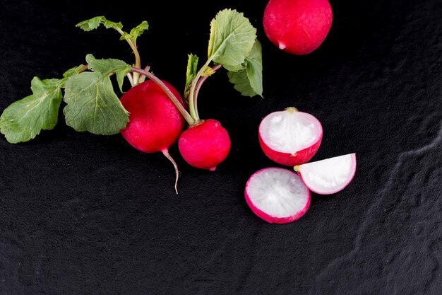 Red fresh radish on wooden