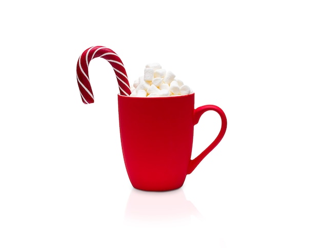 Red frosted cup with lollipop and marshmallow isolated on a white background