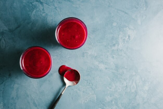 Red fruity smoothie in glasses 