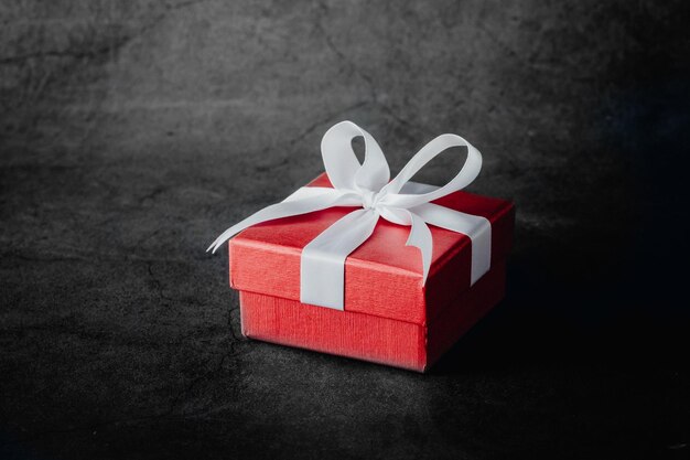 red gift box on black table