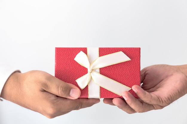 Red gift box on hands