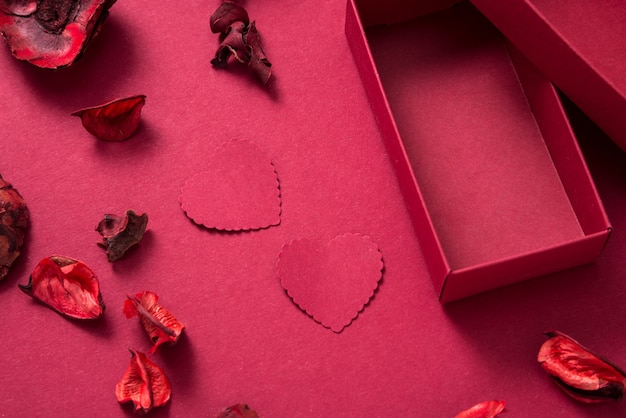 Red gift box and paper hearts