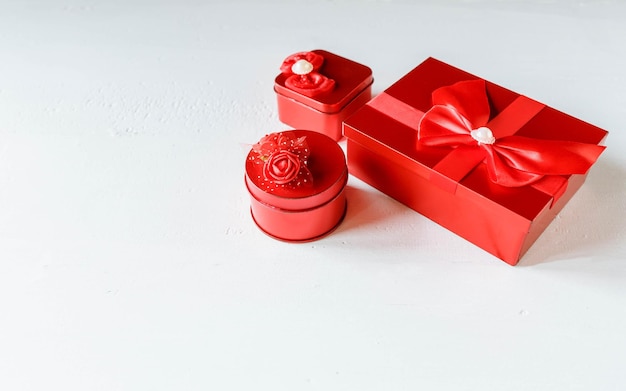 Red gift box on white wooden background