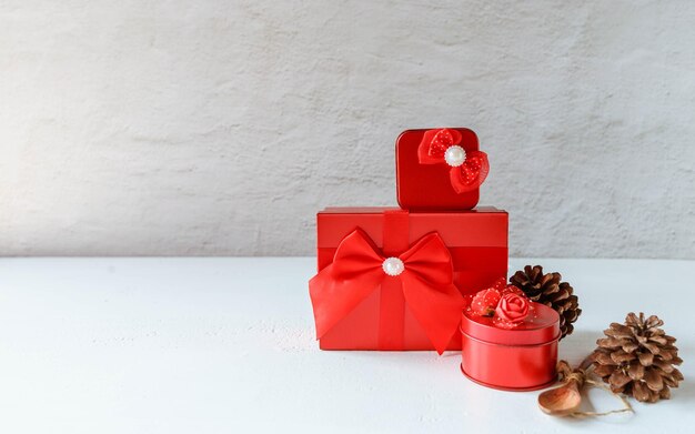 Red gift box on white wooden background