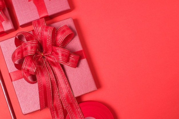 Red Gift Box with Decorations on Red background.Merry Christmas and Happy New Year Holiday Concept