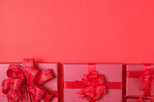 Red Gift Box with Decorations on Red background.Merry Christmas and Happy New Year Holiday Concept