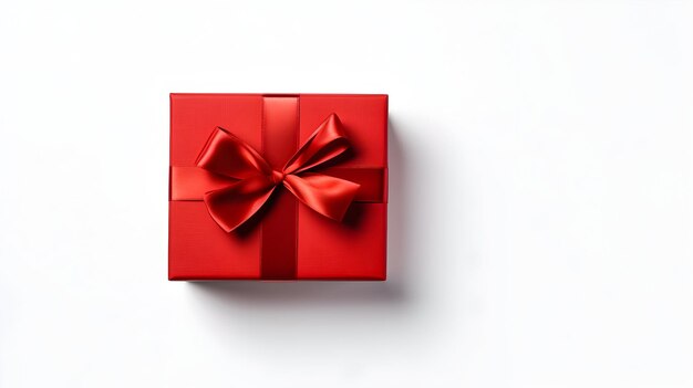 Red gift box with red ribbon on white