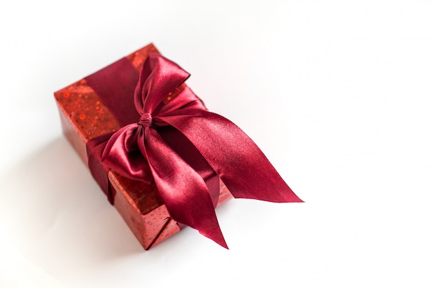 Red gift box with a red ribbon