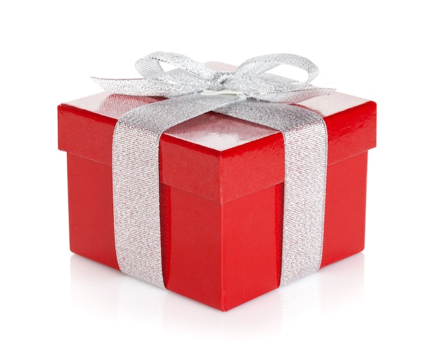 Red gift box with silver ribbon and bow. Isolated on white background