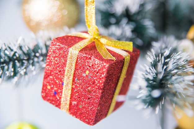 Red gift decoration on Christmas tree