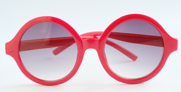 Photo red glasses on white background ,close up object