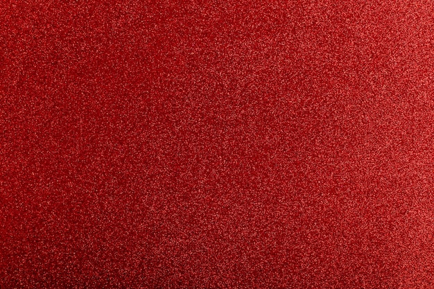 Photo red glitter lights background pattern defocused.