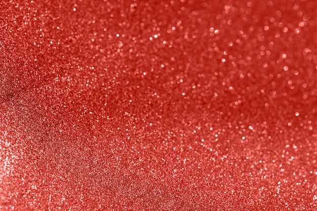 Red glitter texture christmas abstract background. Shiny wrapping paper texture, greeting card design element.