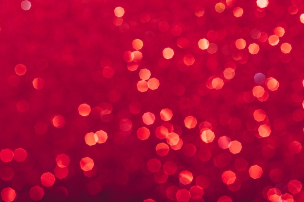 Red glowing sequins blurred background