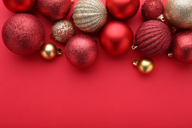 Red and gold christmas balls on a red background