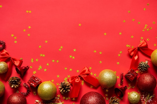 Red and gold Christmas balls on a red background.