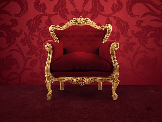 Red and gold luxury armchair into an old room